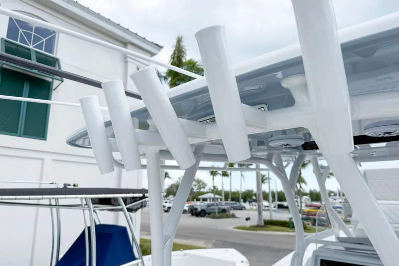 Slide: The Image of 2024 Yellowfin 34 Offshore boat with rod holders and T-top detail. - 18