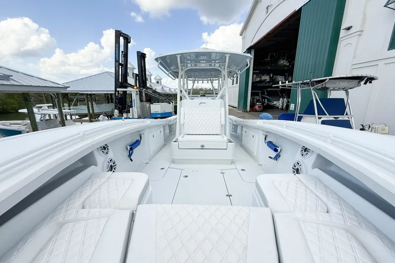 Slide: The Image of 2024 Yellowfin 34 Offshore boat interior with white seating and modern design. - 9