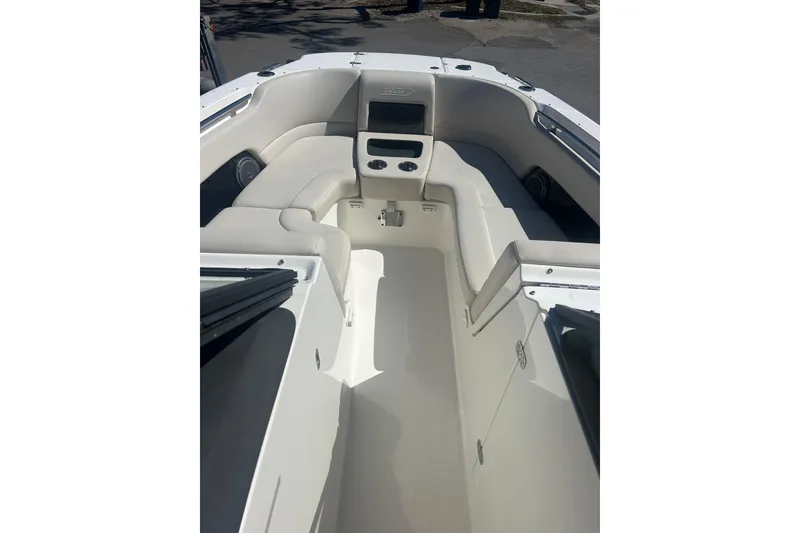 Slide: The Image of 2018 Boston Whaler 270 Vantage boat interior with white seating and console. - 16