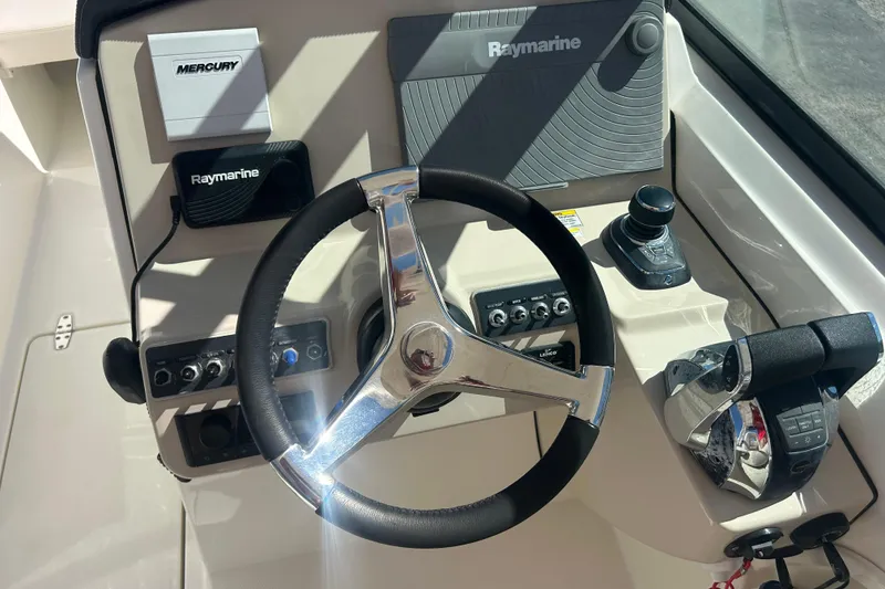 Slide: The Image of 2018 Boston Whaler 270 Vantage helm with Raymarine electronics and Mercury controls. - 24