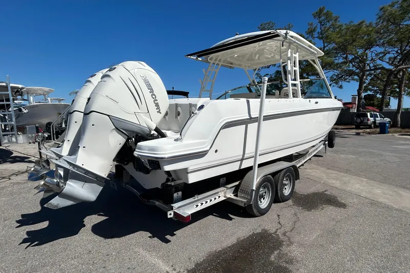 Slide: The Image of 2018 Boston Whaler 270 Vantage boat on trailer with dual Mercury outboard engines. - 4