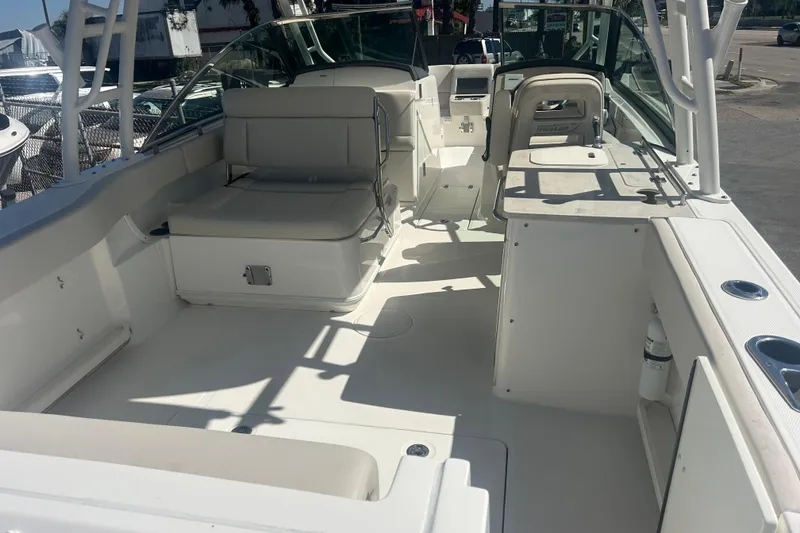 Slide: The Image of 2018 Boston Whaler 270 Vantage boat interior with seating and storage compartments. - 8