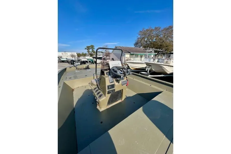 Slide: The Image of 2021 Tracker Grizzly 2072 CC boat with central console and Garmin equipment. - 3