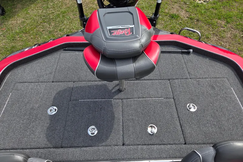 Slide: The Image of 2020 Ranger Z520C Cup-Equipped boat deck with red and black seat, gray carpet. - 12