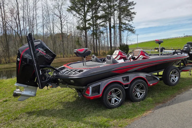 Slide: The Image of 2020 Ranger Z520C Cup-Equipped boat with Mercury Pro XS engine on grassy area. - 2