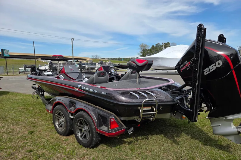 Slide: The Image of 2020 Ranger Z520C Cup-Equipped boat with powerful 250 engine, parked on grass. - 4