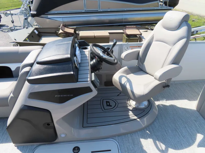 Slide: The Image of Interior of 2026 Premier SUNSATION 210 RL with helm console and seat. - 12