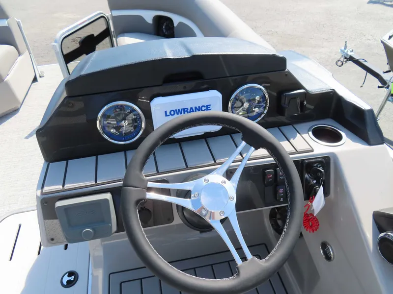 Slide: The Image of 2026 Premier SUNSATION 210 RL helm with Lowrance display. - 19