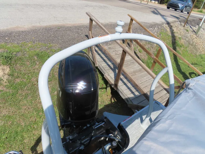 Slide: The Image of Premier SUNSATION 210 RL 2026 with outboard motor and wooden bridge. - 22