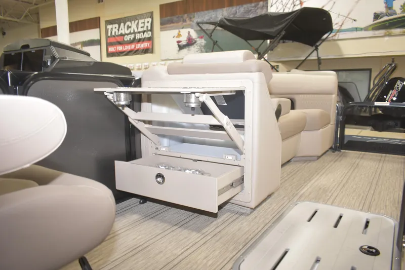 Slide: The Image of 2026 Premier 230 SOLARIS RL - PTX CL boat interior with open storage compartment. - 10