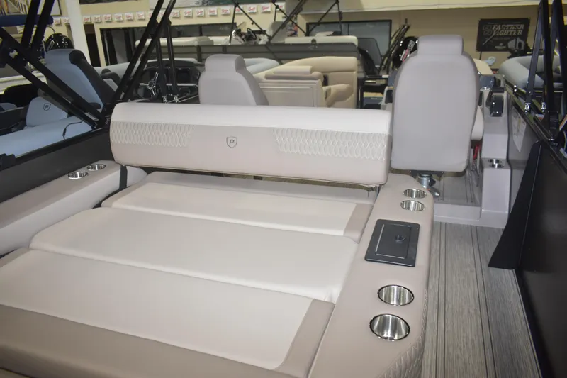 Slide: The Image of 2026 Premier 230 Solaris RL - PTX CL boat interior with luxurious seating and cup holders. - 14