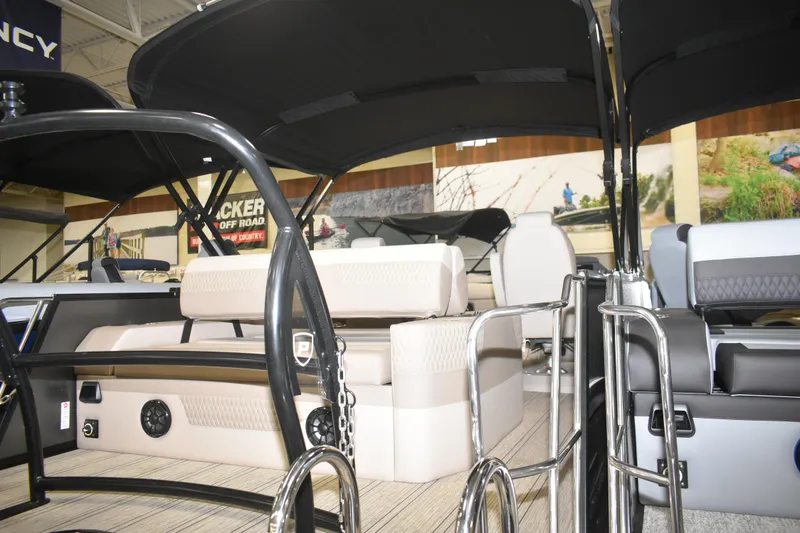 Slide: The Image of 2026 Premier 230 SOLARIS RL - PTX CL pontoon boat interior with seating and canopy. - 18