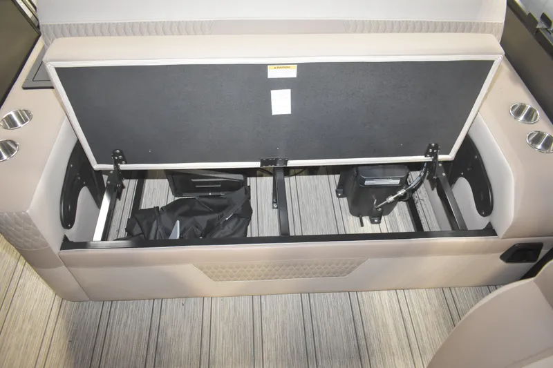 Slide: The Image of Open storage compartment in 2026 Premier 230 Solaris RL - PTX CL boat interior. - 21