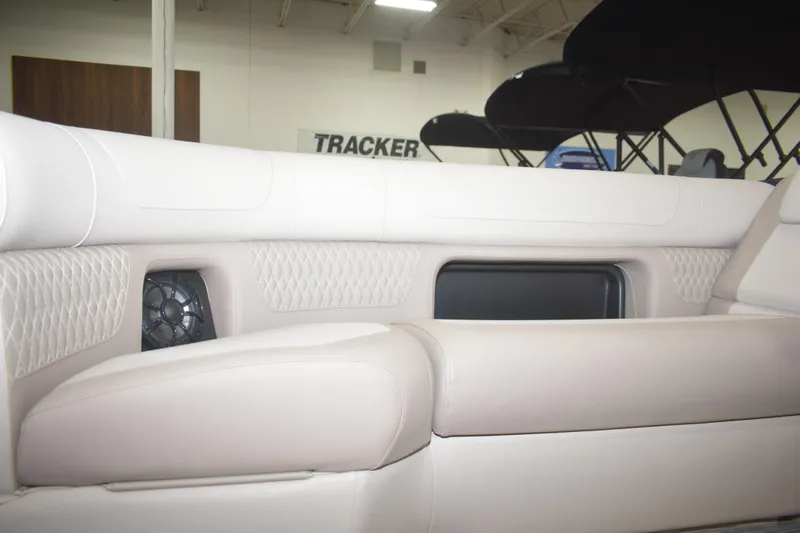 Slide: The Image of Luxurious seating in 2026 Premier 230 Solaris RL boat, featuring elegant upholstery and integrated speaker. - 3