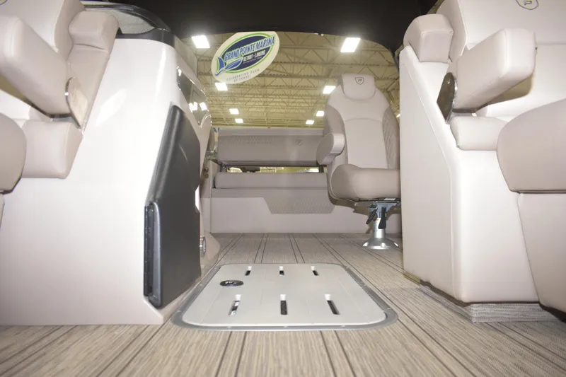 Slide: The Image of Interior view of 2026 Premier 230 SOLARIS RL - PTX CL boat with beige seating and wood flooring. - 5