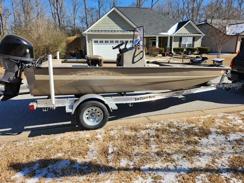 The Image of 2021 Excel Stealth boat on trailer parked in front of house. - 0