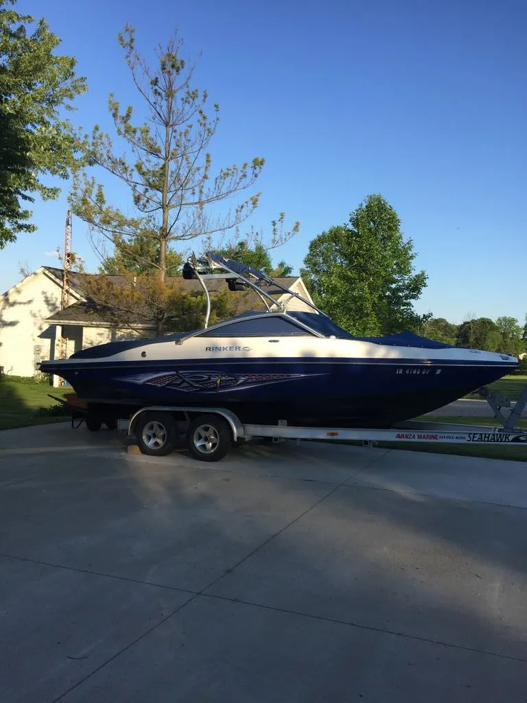 Slide: The Image of 2007 Rinker 226 Captiva Bowrider on trailer outdoors. - 4