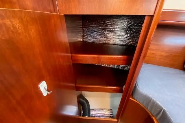 Slide: The Image of Wooden interior storage cabinet on a 2005 Beneteau Oceanis 373 sailboat. - 14