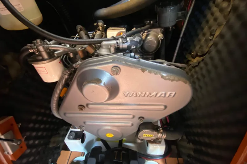 Slide: The Image of Yanmar engine in a 2005 Beneteau Oceanis 373 sailboat, showcasing mechanical components. - 23