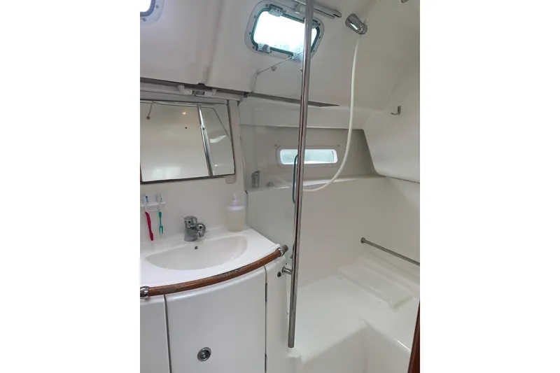Slide: The Image of Interior bathroom of 2005 Beneteau Oceanis 373 sailboat, featuring sink and shower. - 27