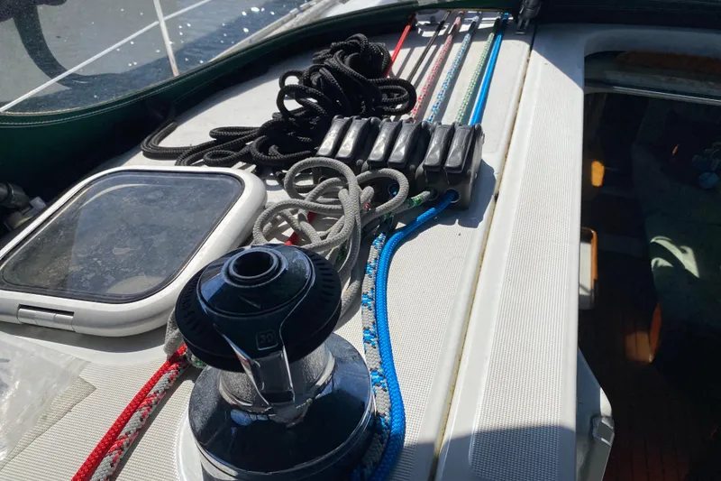 Slide: The Image of Deck of 2005 Beneteau Oceanis 373 sailboat with winch, ropes, and hatch. - 30