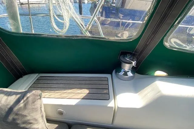 Slide: The Image of Interior view of 2005 Beneteau Oceanis 373 sailboat with winch and seating area. - 36