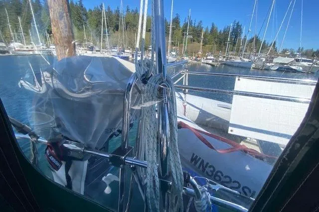 Slide: The Image of Beneteau Oceanis 373 sailboat, 2005 model, docked in a marina with clear blue skies. - 41