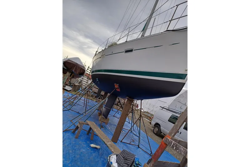 Slide: The Image of 2005 Beneteau Oceanis 373 sailboat on stands, ready for maintenance. - 43