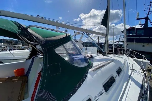 Slide: The Image of 2005 Beneteau Oceanis 373 sailboat docked under a sunny sky. - 5