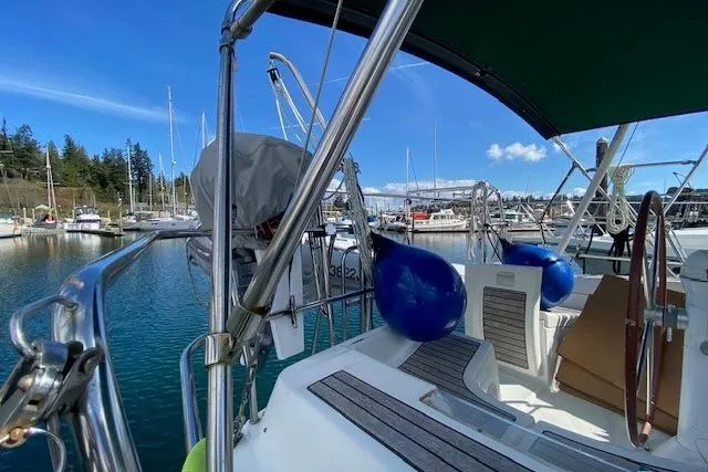Slide: The Image of 2005 Beneteau Oceanis 373 sailboat docked in a marina, sunny day, blue sky. - 6