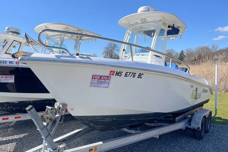 The Image of 2013 Everglades 230 Center Console boat for sale on trailer, sunny day. - 0