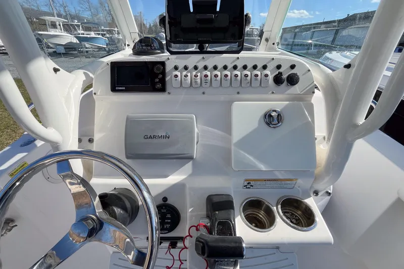Slide: The Image of Control panel of a 2013 Everglades 230 Center Console boat with Garmin navigation. - 5