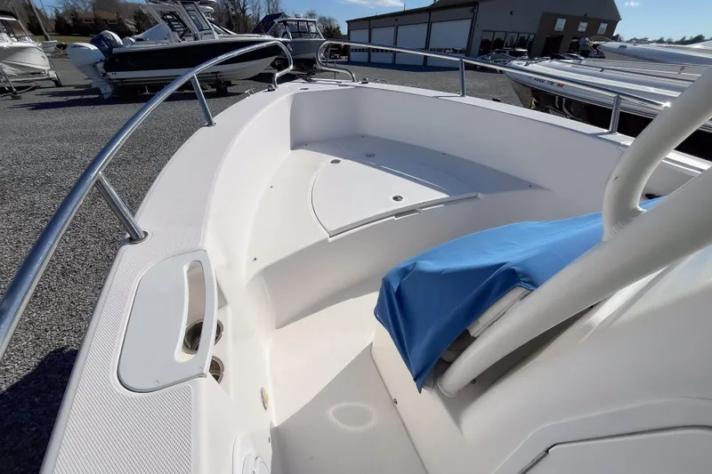 Slide: The Image of 2013 Everglades 230 Center Console boat interior with seating and railings. - 7