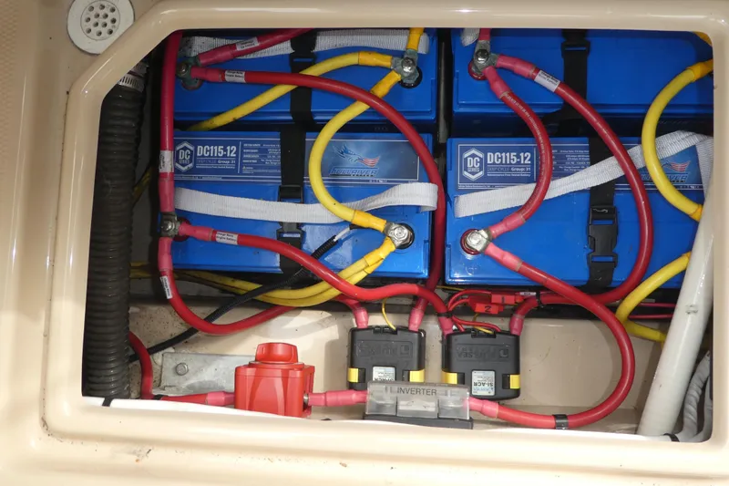 Slide: The Image of Battery compartment of 2015 Ranger Tugs R-25 SC with wiring and connections. - 21