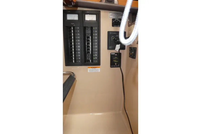 Slide: The Image of Electrical panel of 2015 Ranger Tugs R-25 SC boat, featuring switches and controls. - 6