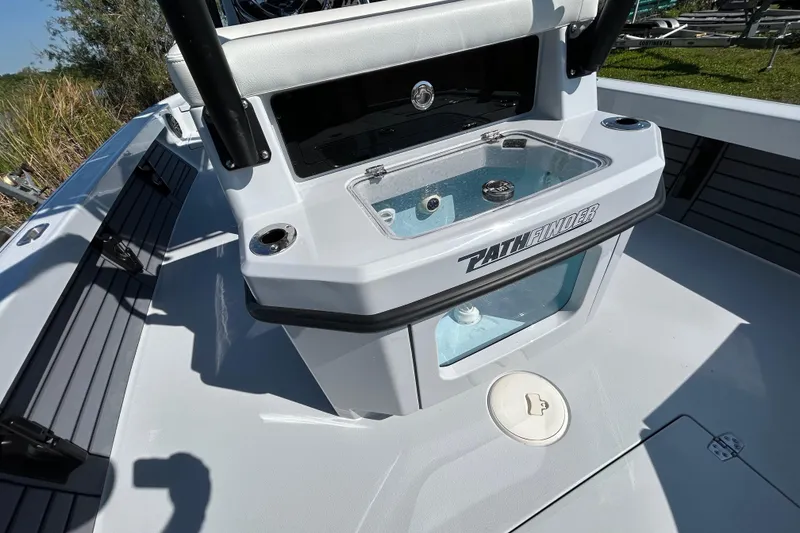 Slide: The Image of 2026 Pathfinder 2500 Hybrid boat interior with livewell and seating area. - 13