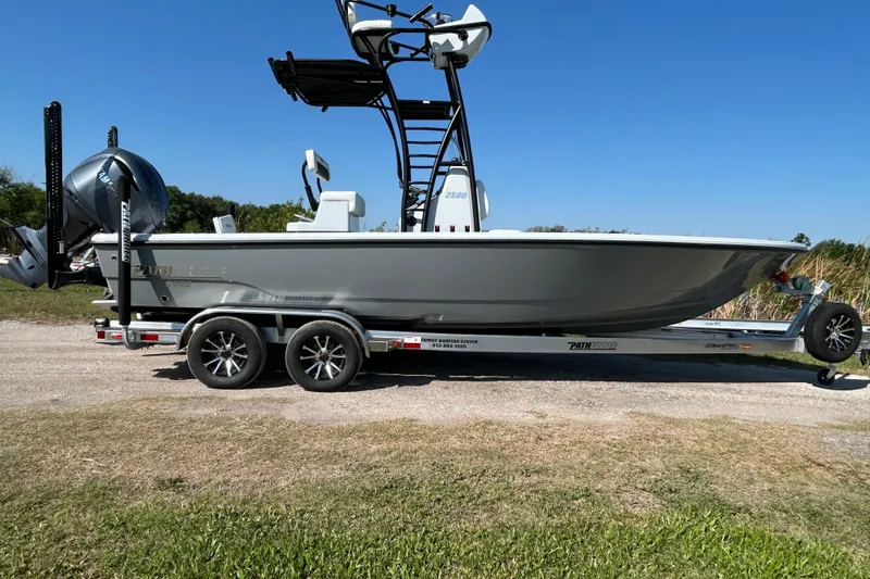 Slide: The Image of 2026 Pathfinder 2500 Hybrid boat on trailer, side view, outdoors. - 4
