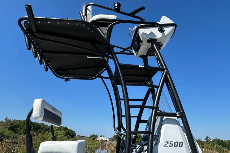 Slide: The Image of 2026 Pathfinder 2500 Hybrid boat tower against clear blue sky. - 7
