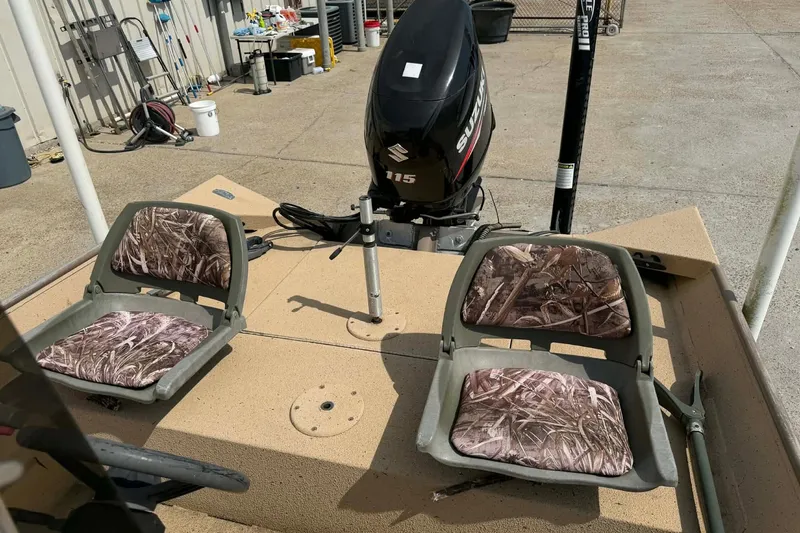 Slide: The Image of 2014 Southfork 1860 boat with camo seats and Suzuki 115 outboard motor. - 6