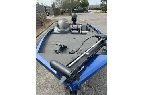 Slide: The Image of 2013 Lowe Stinger 175 boat, blue exterior, parked outdoors. - 3