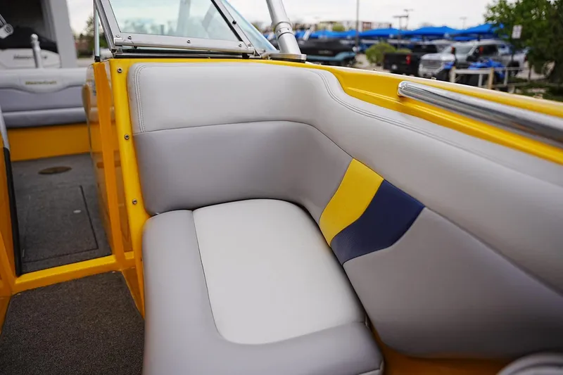 Slide: The Image of Interior of a 2007 MasterCraft X10 boat with yellow and gray seating. - 8