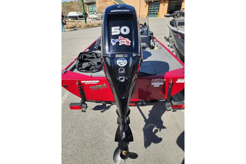 Slide: The Image of 2024 Tracker Bass Tracker Classic XL with Mercury 50 outboard motor, parked outdoors. - 3