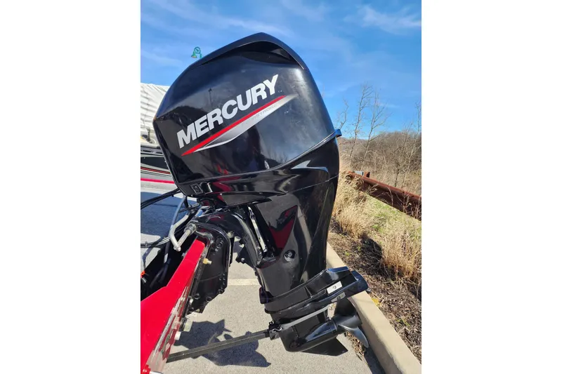 Slide: The Image of 2024 Tracker Bass Tracker Classic XL with Mercury outboard motor, parked outdoors. - 6