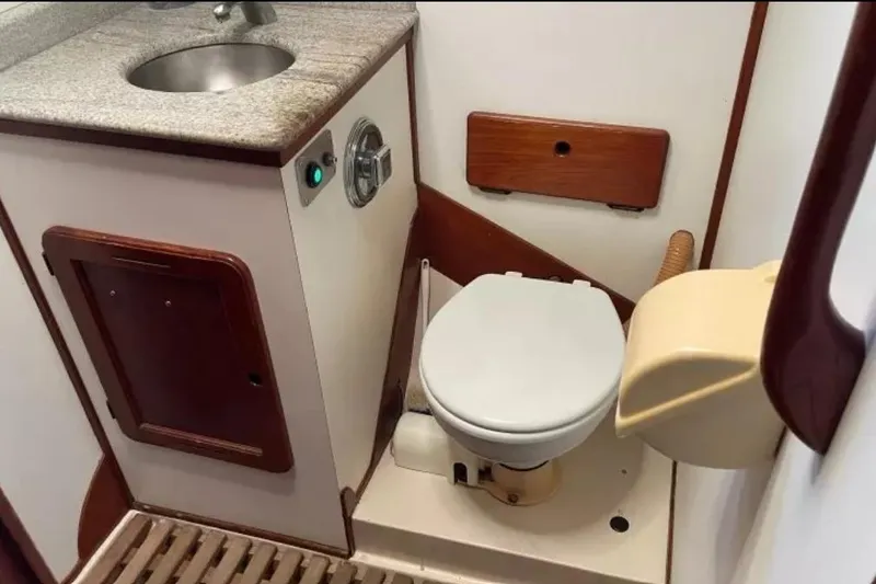 Slide: The Image of Compact bathroom in a 1980 Morgan 462 yacht, featuring a toilet and sink. - 15