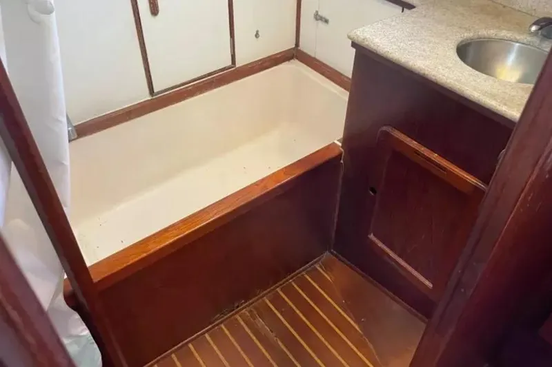 Slide: The Image of 1980 Morgan 462 yacht bathroom with wooden cabinetry and compact sink. - 17