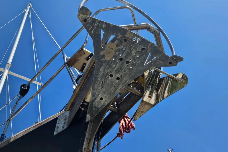 Slide: The Image of Bow of 1980 Morgan 462 sailboat with anchor, against clear blue sky. - 28