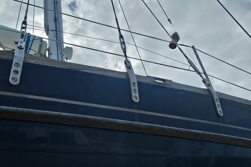 Slide: The Image of 1980 Morgan 462 sailboat rigging against cloudy sky. - 33