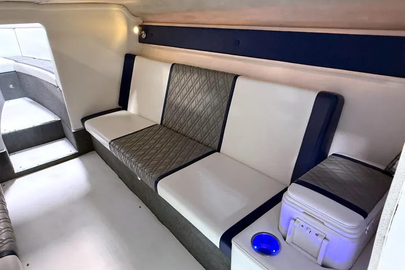 Slide: The Image of Interior of a 2008 Sleekcraft 34' Heritage boat with cushioned seating and modern design. - 10