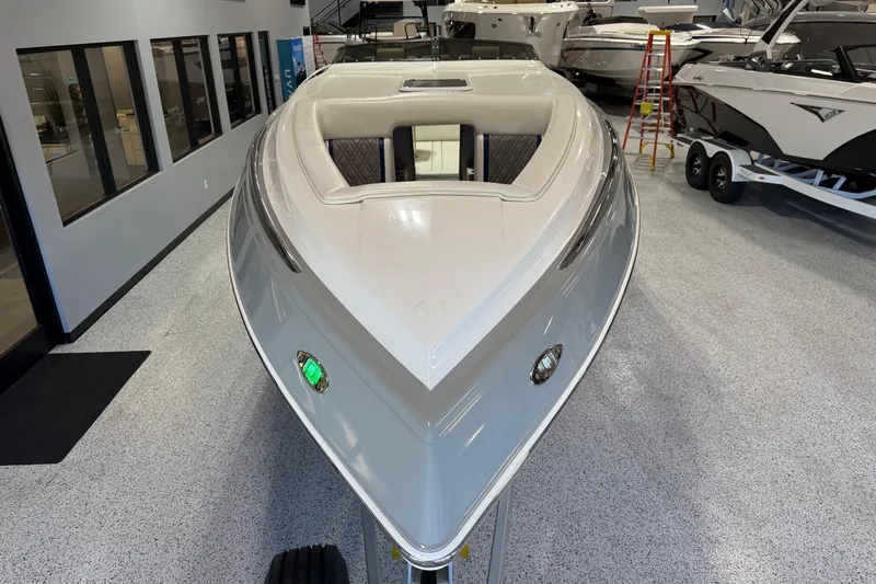 Slide: The Image of 2008 Sleekcraft 34' Heritage boat displayed indoors, showcasing sleek design and modern features. - 15