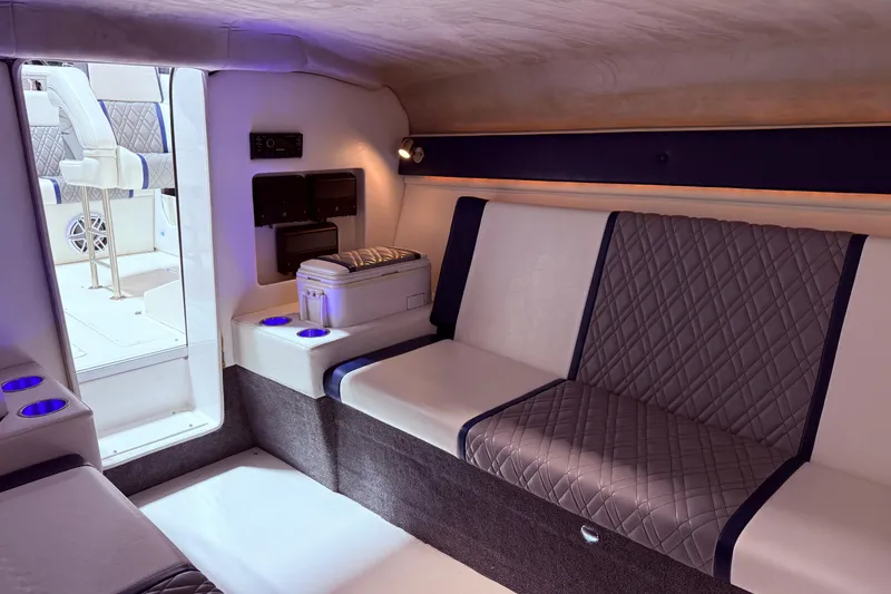 Slide: The Image of Luxurious interior of 2008 Sleekcraft 34' Heritage boat with quilted seating and ambient lighting. - 17